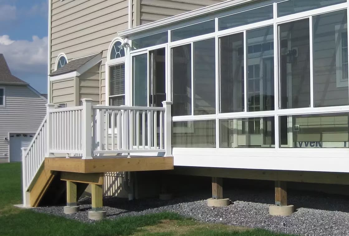 A Hudson Valley Sunrooms crew mid-installation on a home