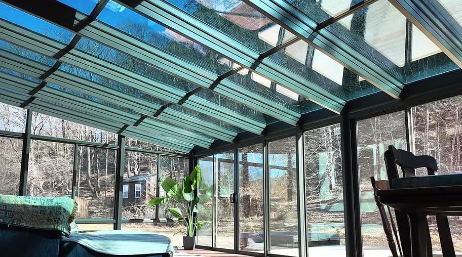 Inside a glass sunroom built by Hudson Valley Sunrooms